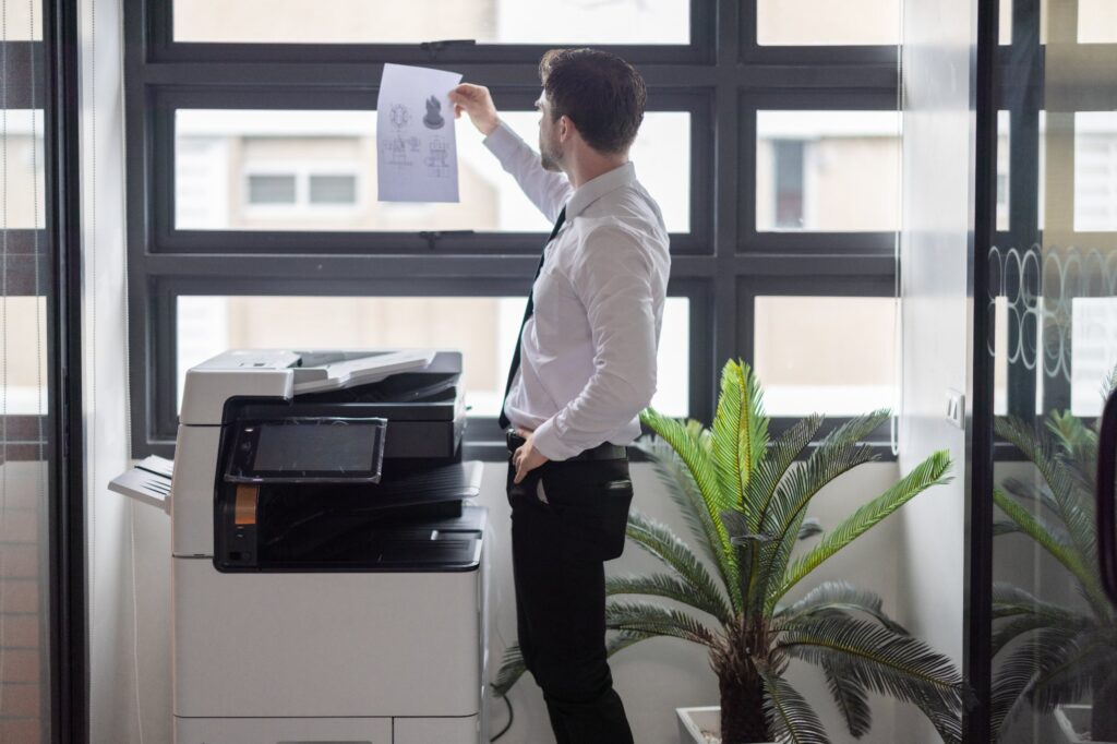 professional-analyzes-document-printout-by-copier-2026-01-07-06-20-21-utc