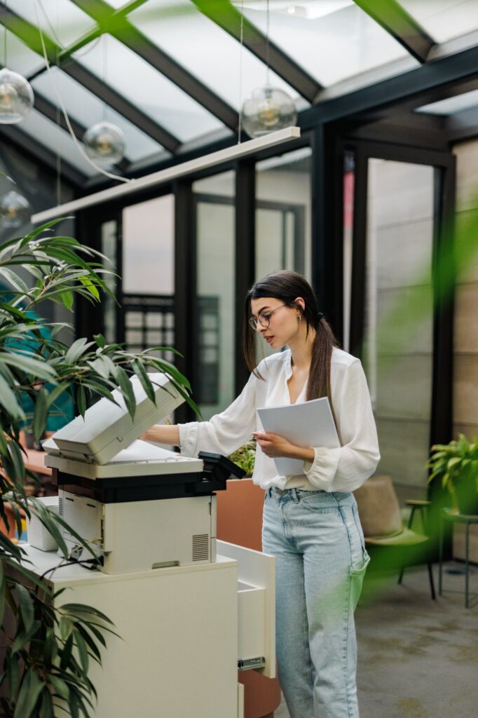 young-woman-using-office-printer-at-workplace-2026-01-08-08-15-32-utc